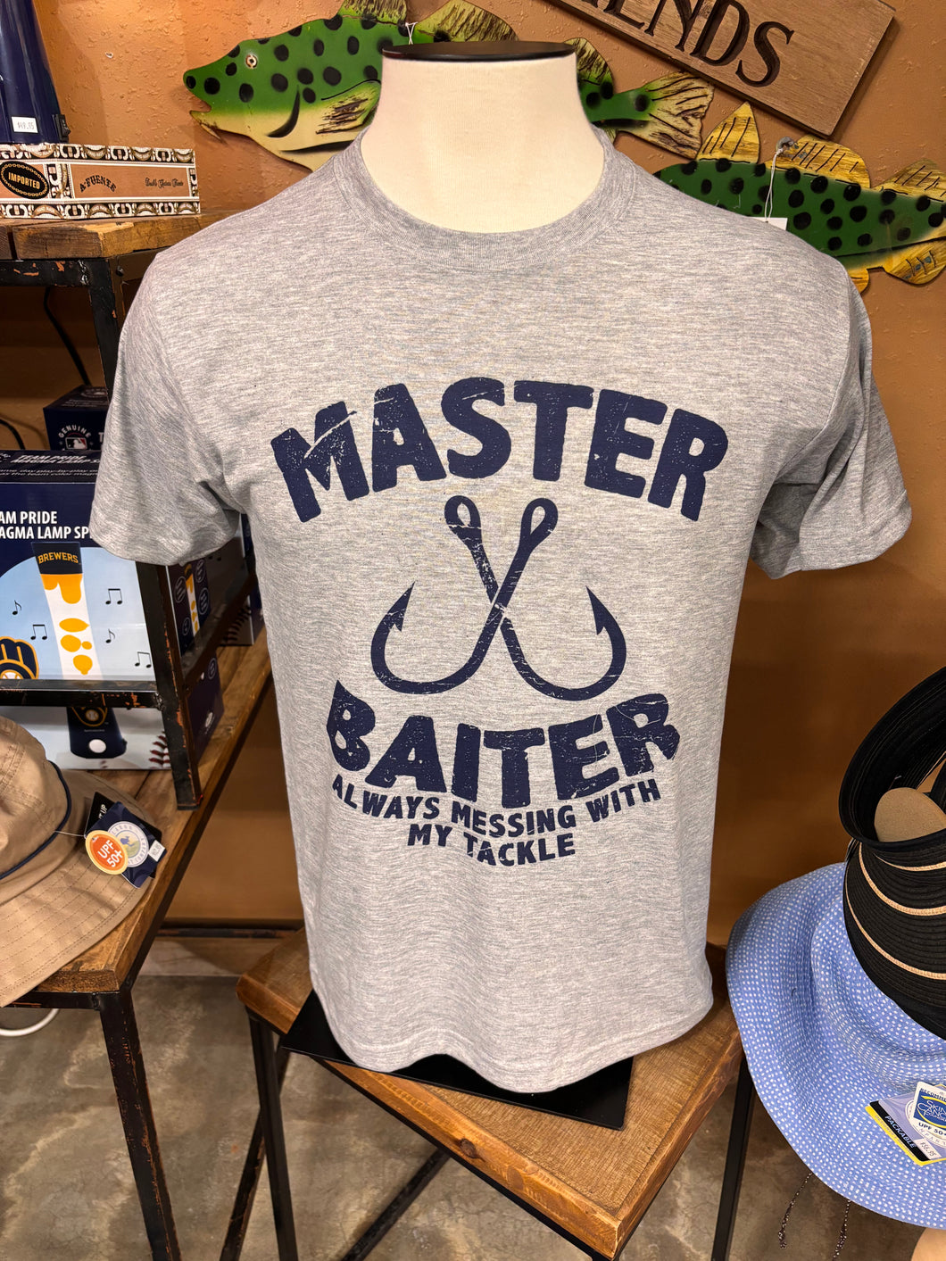 Funny adult humor referencing fishing t-shirt that has a play on words for Master Baiter. Short sleeve t-shirt perfect for the fishing enthusiast that has a sense of humor. 