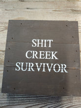 Load image into Gallery viewer, ‘SHIT CREEK SURVIVOR, ’ 6” BY 6”, HANDMADE, DARK FINISH, WOODEN SIGN. MADE BY ‘SECOND NATURE BY HAND’ FROM 100-YEAR OLD HOMES NOT BEING REPLACED. EACH IS UNIQUE.
