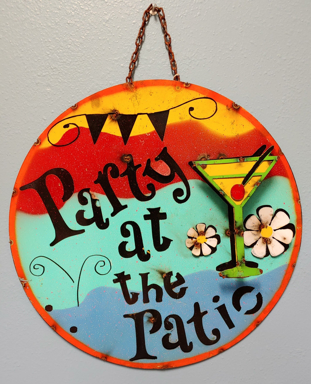 Bright colors of yellow red, aqua and blue bring this rustic metal sign to life. Martini with cherry featured drink.