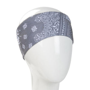 A WHITE MANNEQUIN HEAD IS WEARING A, 9.5 INCHES WIDE BY 19 INCHES LONG, STRETCHABLE INFINITY SCARF. THIS ONE IS A WHITE DESIGN ON A GREY BACKGROUND PATCHWORK MOTIF.