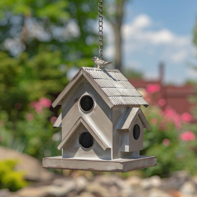 Hanging galvanized house shaped metal birdhouse. Bring nature to your outdoor living area. 