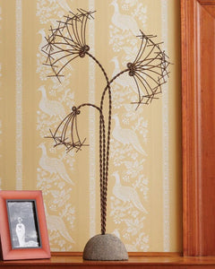 Metal papyrus flower with river stone stand 30" tall