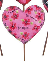 Load image into Gallery viewer, pink metal heart on a stake.  be mine!  and pink flowers with green leaves on painted on it.  Touch of glitter to add sparkle