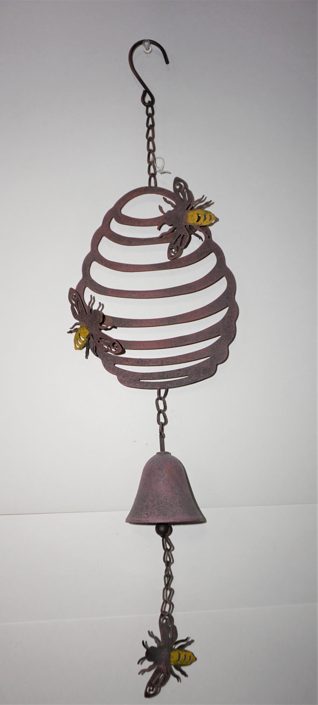 Metal Honey comb with 3 small bees attached that hangs.  There is a bell that will chime in the wind.