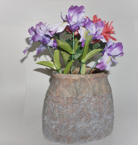tall oval terra cotta planter with embossed filigree design.  Tuscan or French Design