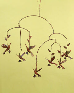 copper hummingbird mobile with 7 hummingbirds dancing around