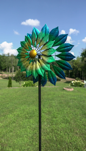 THIS NEW MONTEREY, HH136, 7’ TALL KINETIC WIND SPINNER IS PAINTED WITH METALLIC AUTOMOBILE PAINT TO REDUCE FADING AND PEELING. THE BLUE, GREEN, AND GOLD LEAF BLADES TURN IN 2 DIFFERENT DIRECTIONS. IT IS METAL CONSTRUCTION WITH SOME ASSEMBLY REQUIRED. THIS WILL BE DELIVERED BY UPS GROUND.