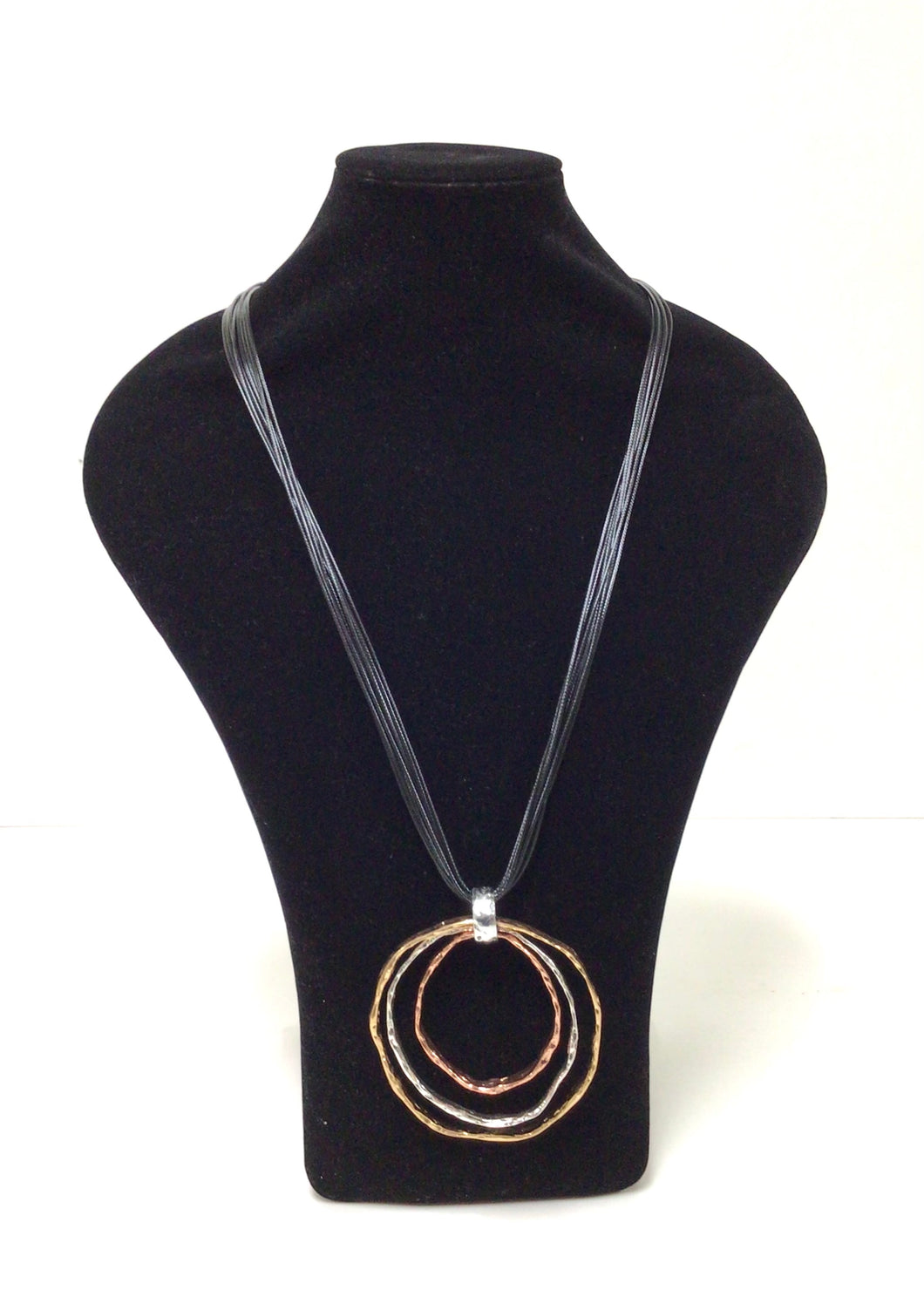 Women's Long Tri-Color Metallic Nested Circles Pendant Necklace on Black Braided Cord Large circle is goldstone, med circle is silver tone, small circle is copper tone. Necklace is 16