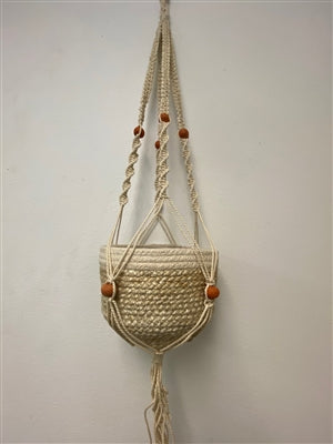 tan jute macrame plant hanger with brown roud beads.  4 strands.