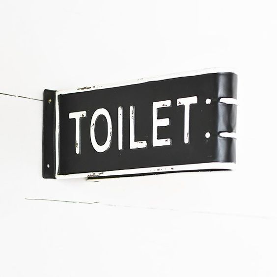 This hand-crafted toilet sign has a comical look that easily serves the purpose of providing directions. It is made from metal with a power coated finish and Vintage look.