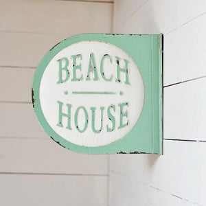 Round 3 dimensional vintage looking sign that mounts on the wall.  Double sided with green boarders and green lettering that reads beach house