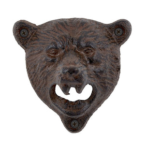 cast iron bear head.  There is is a hole in each ear for mounting.  The mouth is open and the bottle catches on the teeth to open the bottle.