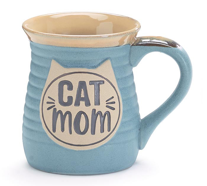 LIGHT BLUE, RIBBED MESSAGE MUG. HAS ‘CAT MOM’ INSIDE A CAT FACE DESIGN. DISHWASHER SAFE|FDA APPROVED|MICROWAVE SAFE. PORCELAIN, HAND-PAINTED, AND INDIVIDUALLY GIFT BOXED.
