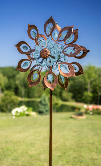 THIS NEW FOR 2021, BOZEMAN, 6’ TALL BY 24” WIDE, KINETIC WIND SPINNER IS PAINTED WITH METALLIC AUTOMOBILE PAINT TO REDUCE FADING AND PEELING. LIGHT BLUE LEAVES INSIDE THE COPPER LEAVES AND LIGHT BLUE PETAL-SHAPED INNER CIRCLE. THE BLADES TURN IN 2 DIFFERENT DIRECTIONS. IT IS METAL CONSTRUCTION WITH SOME ASSEMBLY REQUIRED. THIS WILL BE DELIVERED BY UPS GROUND.