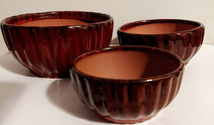 Glazed terra cotta planters for aloe, flowers or house plants.  3 sizes to choose from. Rich burgundy shallow pots for cactus.  These shallow planters have a drainage hole in the bottom.  Use indoor or outdoor.