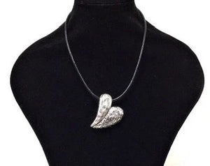 1.75"Wx2.25"L Chunk mottled solid heart pendant hangs at an angle on a 10" black faux leather cord. 