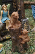 Load image into Gallery viewer, FAIRY GARDEN – 2 BEAR CUBS CLIMBING TREE STUMP. 1 SITTING ON TOP, OTHER CLIMBING | COLORS: CUBS ARE LIGHT BROWN; STUMP IS DARK BROWN. FAIRY GIRL WITH LIGHT GREEN WINDS, BROWN HAIR, LIGHT BLUE DRESS SITTING ON WALL WATCHIN CUBS.