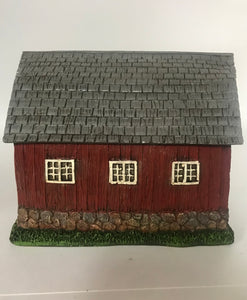 silver shake shingles.  Cobblestone base. With 3 side windows.