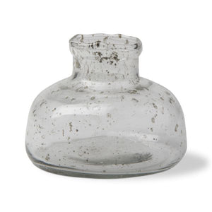 This decorative transparent bud glass vase is mouth blown. this inkwell shaped piece is modern and versatile