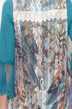 Load image into Gallery viewer, BACK VIEW CLOSEUP OF IVORY LACE JACKET-VEST/LONG LACE HEM | LONGER IN BACK THAN IN FRONT | SIZES S, M, L, PLUS| SCALLOPED, LACE, RUFFLE TRIM/FLORAL AND FEATHERS PRINT | TEAL BLOUSE (LONG LACE CUFFS)/SKINNY-LEGGED BLUE JEANS/TAN HIGH HEELS