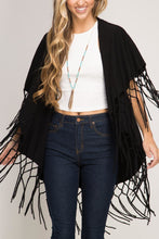 Load image into Gallery viewer, FALL/WINTER WRAP SWEATER/SHAWL WITH MATCHING MACRAME FRINGE. WOMAN WEARING A BLACK SHAWL OVER WHITE, SLEEVELESS SWEATER, TURQUOISE/GOLD NECKLACE, AND BLUE JEANS. OTHER COLORS ARE SAGE, BROWN, LIGHT BLUE, AND RUST.