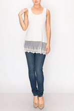Load image into Gallery viewer, THE WOMAN HAS ON A LONG, WHITE TANK-TOP WITH A MATCHING CROCHETED HEM; IT HANGS BELOW HER WAIST. S TO 2XL. MACHINE WASHABLE. LOOKS GREAT UNDER JACKET OR TUNIC. SHE HAS DARK BLUE SKINNY JEANS AND IVORY HIGH HEELS.